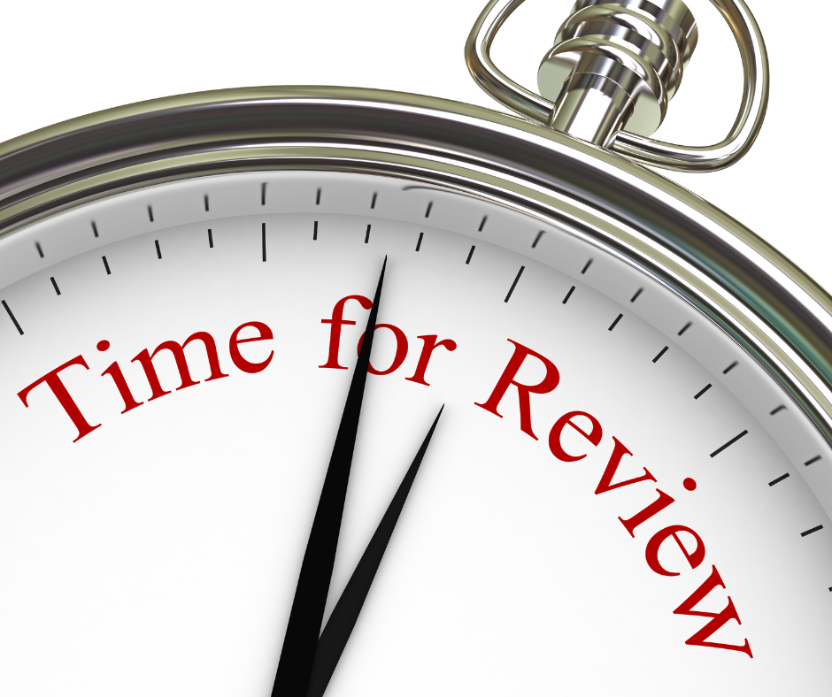 Close up of an analog clock face with the hands pointing to the label: Time for Review.